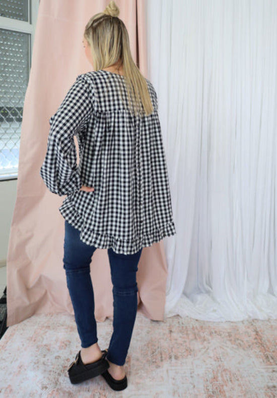 Black gingham long sleeve top by Daisy's Closet, featuring a classic pattern and relaxed fit, perfect for casual wear.