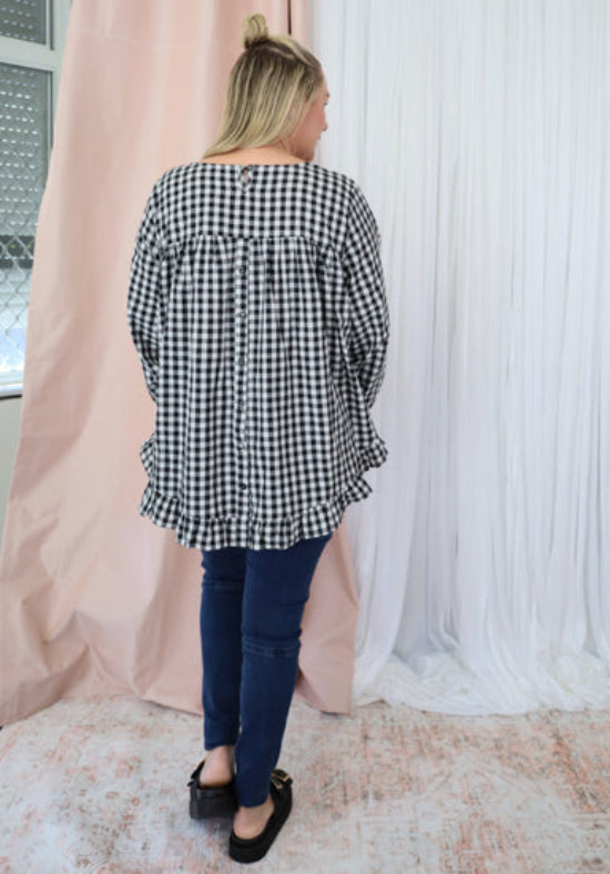 Black gingham long sleeve top by Daisy's Closet, featuring a classic checkered pattern and a fitted design for casual wear.