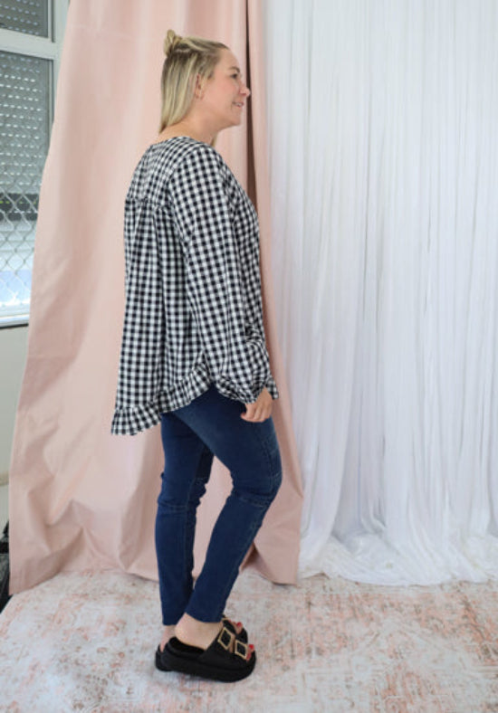 Black gingham long sleeve top for women from Daisy's Closet, featuring a stylish and comfortable casual design.