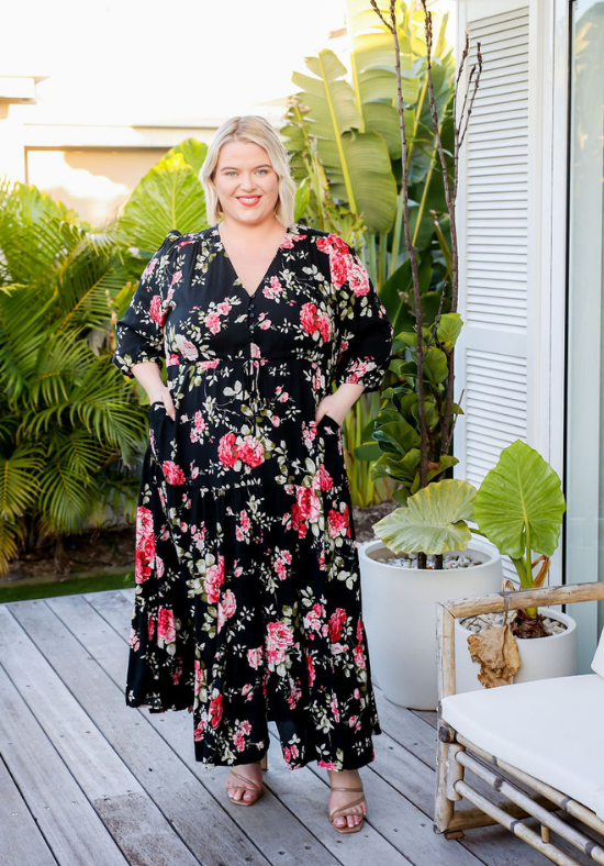 Ladies Black Maxi Dress - Long Sleeve - Functional Button Up Bust - Adjustable Tie Under Bust - Split from Knee to bottom Hemline - Long Sleeve - Sizes 6 - 26 - Concealed Side POckets - Sarah Maxi Dress Size 20 Front Full Length View Showing Pockets - Daisy's Closet