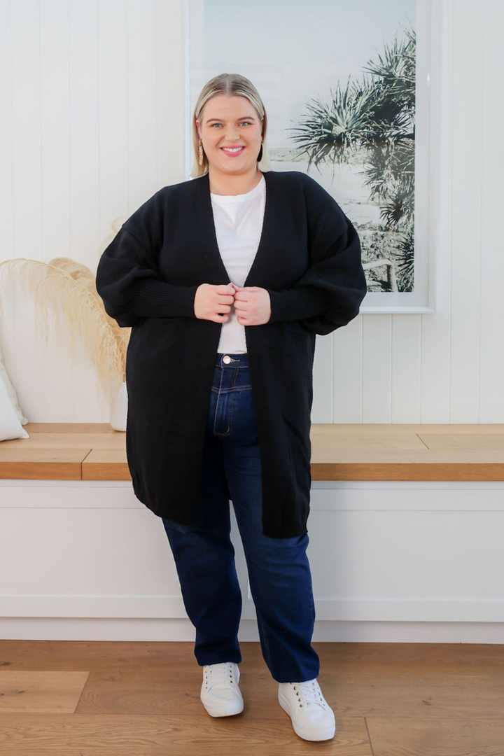 Ladies Cardigan - Black - Longline Cardigan - Funtional Front Pockets - Front Functional Pockets - Long Balloon Sleeve - Maya Cardigan Black Size L/XL Paired with Carter Dark Denim Jeans  - Daisy's Closet