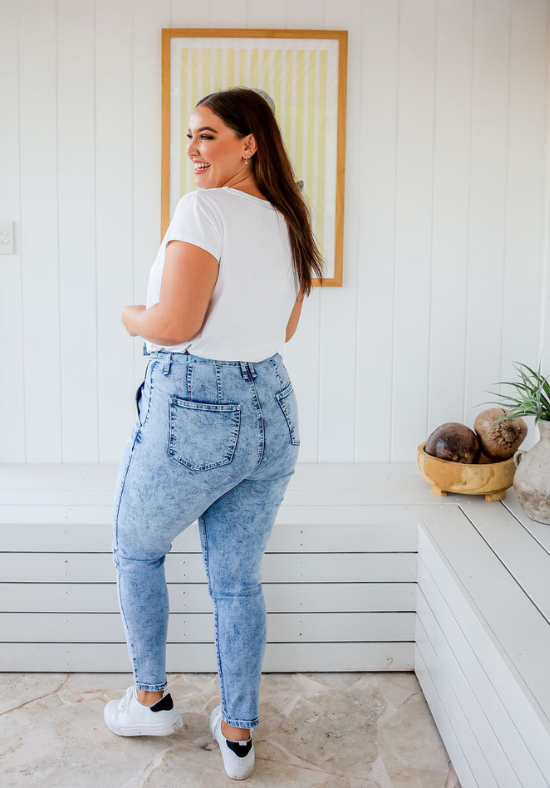 Ladies High Waisted Jeans - Light Blue Acid Wash - Optional Tie Belt at Waist - Functional Front and Back Pockets - Zip Front - Full Length - Sizes 6 - 18 - Daisy Denim Jeans Back Full Length View Paired with Daisy T-Shirt White - Daisy's Closet