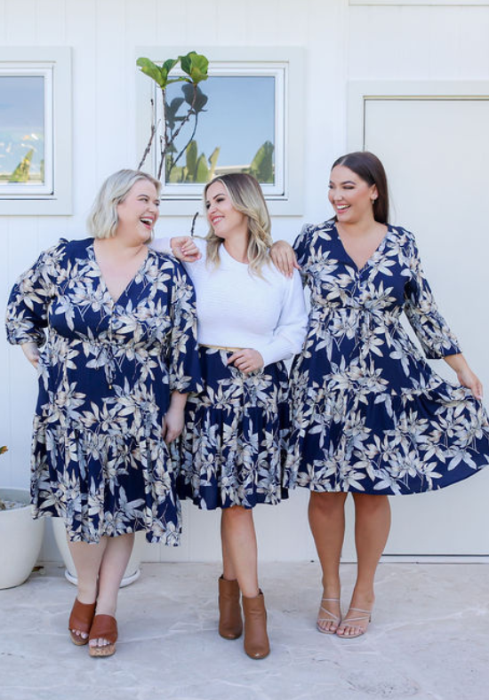 Ladies Long Sleeve Boho Dress - Navy Blue With White Floral Print - Concealed Side POckets - Button Up Bust Detail - Adjusatble Tie Under Bust - Knee Length Dress - Maternity and Breastfeeding Friendly - Sizes 6 - 26 - Carly Dress Showing Sizes 10 - 20 + 14 - Daisy's Closet