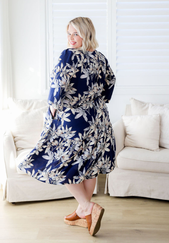 Ladies Long Sleeve Boho Dress - Navy Blue With White Floral Print - Concealed Side POckets - Button Up Bust Detail - Adjusatble Tie Under Bust - Knee Length Dress - Maternity and Breastfeeding Friendly - Sizes 6 - 26 - Carly Dress Size 20 Full Length Back View Showing Pockets - Daisy's Closet