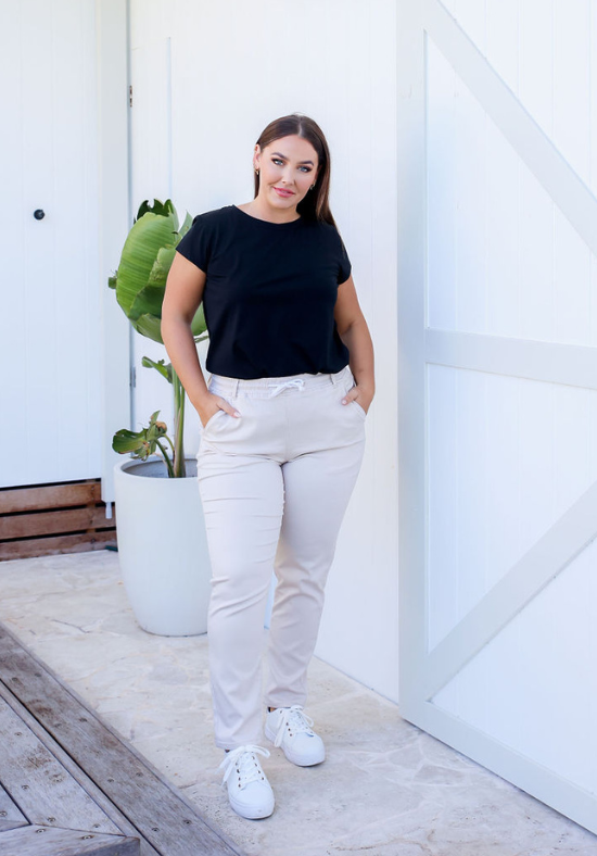 Ladies Stretch Jogger Jeans - Cream - Elasticised Waistband - Functional Front and Back Pockets - Drawstring waist - Pull On Jeans - Sizes 6 - 18 - Jenny Stretch Joggers Size 12 Front Full Length View Paired With Daisy T-Shirt Black - Daisy's Closet
