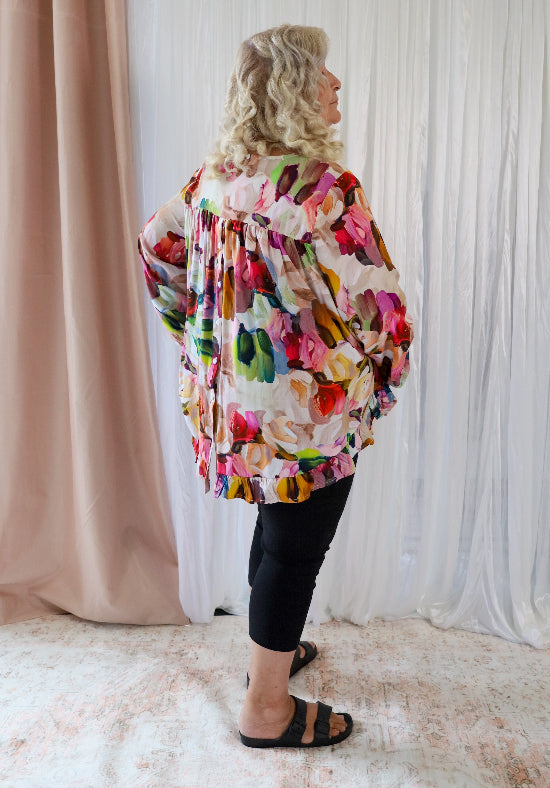 Long sleeve paintbrush print top by Daisy's Closet featuring a button-back design, perfect for casual or artistic style.