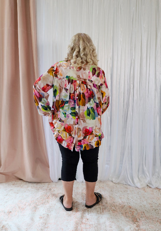 Long sleeve button-back top with paintbrush print from Daisy's Closet, casual shirt featuring artistic design and comfortable fit.