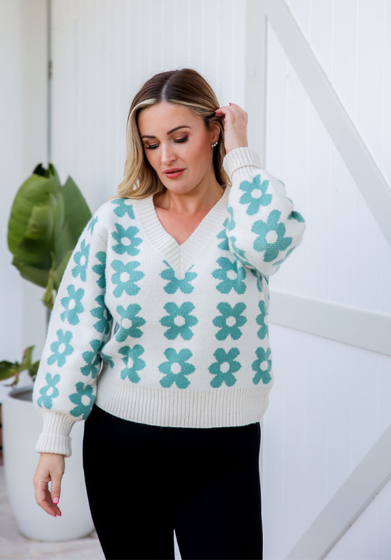 Ldies V Neck Jumper - Knit Jumper - White with Daisy Print Green - Long Sleeve - Sizes S/M - L/XL - Daisy Knit Size S/M Paired With Aria Black Pants Close p Front View Showing Sleeve Detail - Daisy's Closet