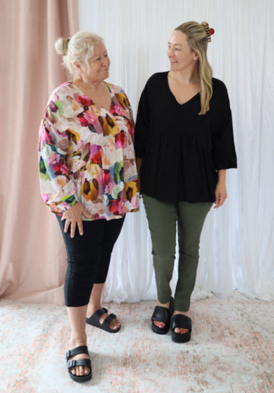Black long sleeve top from Daisy's Closet Remi collection, featuring a stylish and comfortable design.