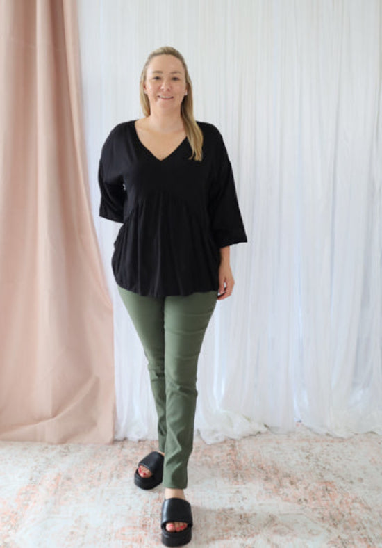 Black Remi long sleeve top by Daisy's Closet, featuring a fitted design and soft fabric, ideal for casual or layered outfits.