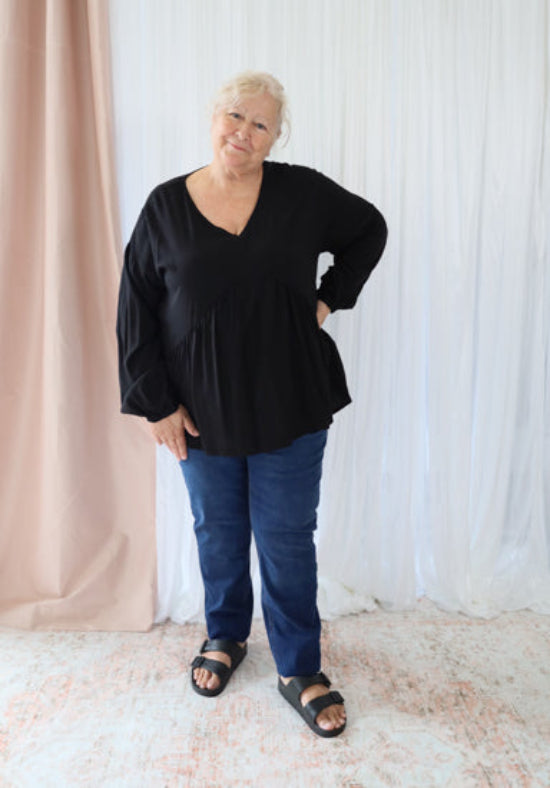 Black long sleeve top by Daisy's Closet featuring a fitted design and soft fabric, perfect for casual or office wear.
