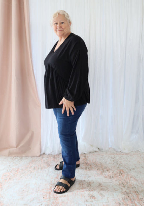 Black long sleeve Remi top by Daisy's Closet featuring a fitted design and soft fabric, perfect for casual or dressy occasions.