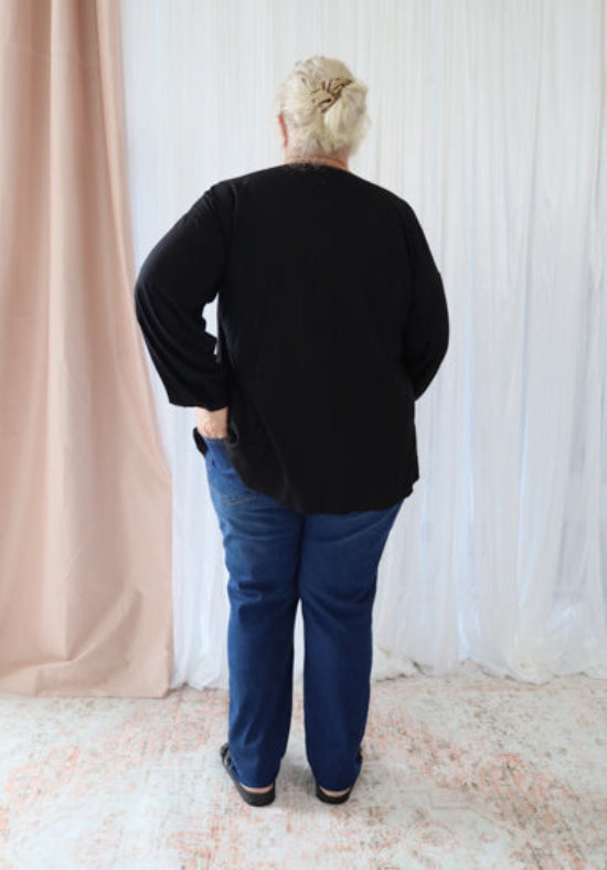 Black long sleeve Remi top by Daisy's Closet, featuring a fitted design and soft fabric, perfect for casual or dressy occasions.