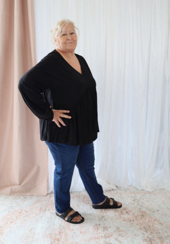 Black long sleeve top from Daisy's Closet, stylish Remi top with fitted design and soft fabric, perfect for casual wear.