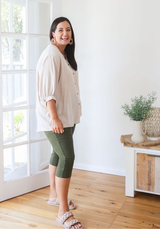 Beige Halley Top from Daisy’s Closet, casual shirt with long sleeves, paired with black jeans in a styled outfit image.