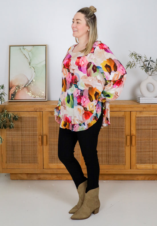 Long sleeve paintbrush print top from Daisy's Closet, featuring a stylish and colorful design on a casual shirt.