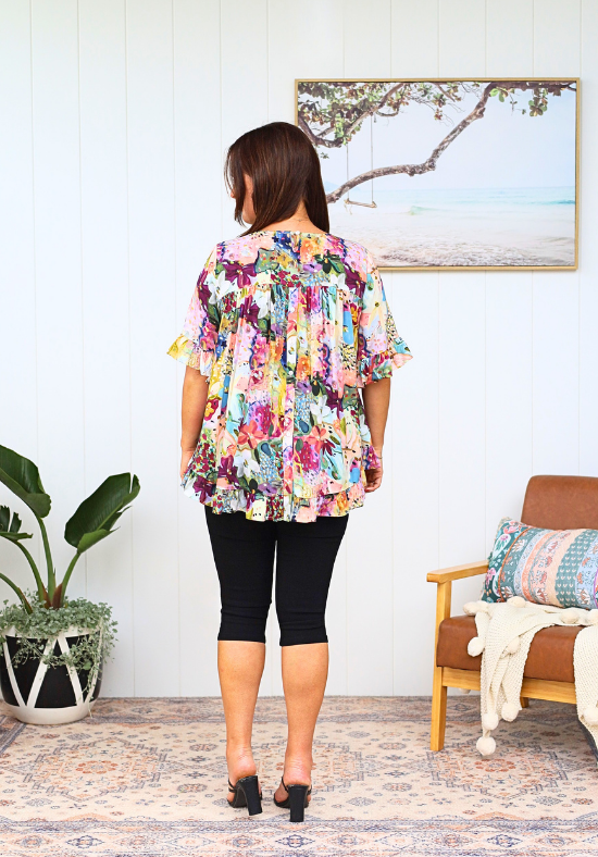 Daisy's Closet New Look Mila Petal Print Top with short sleeves and button back, featuring a floral pattern.