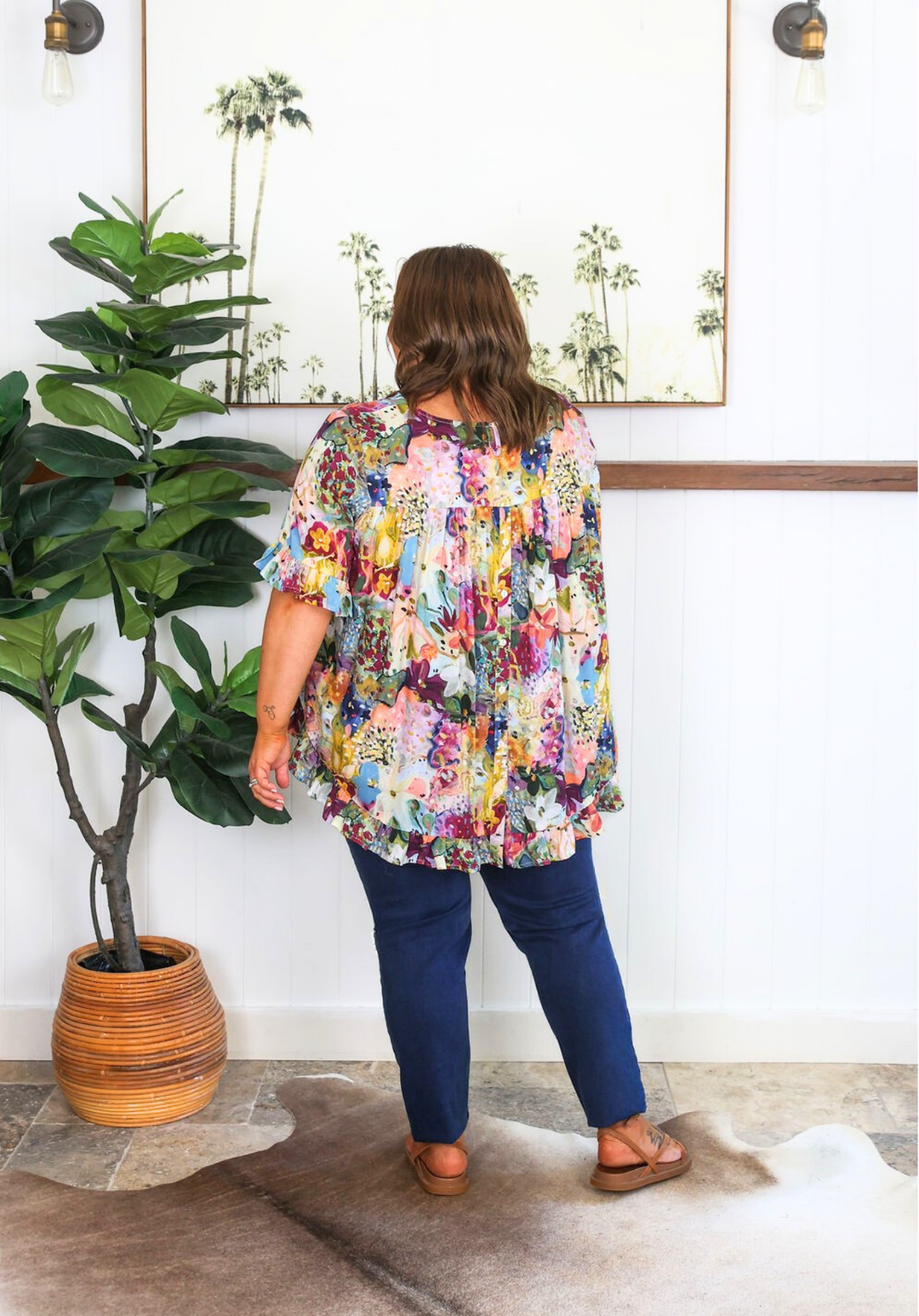 Daisy's Closet New Look Mila Petal Print Top with short sleeves and button-back design, featuring a floral pattern.
