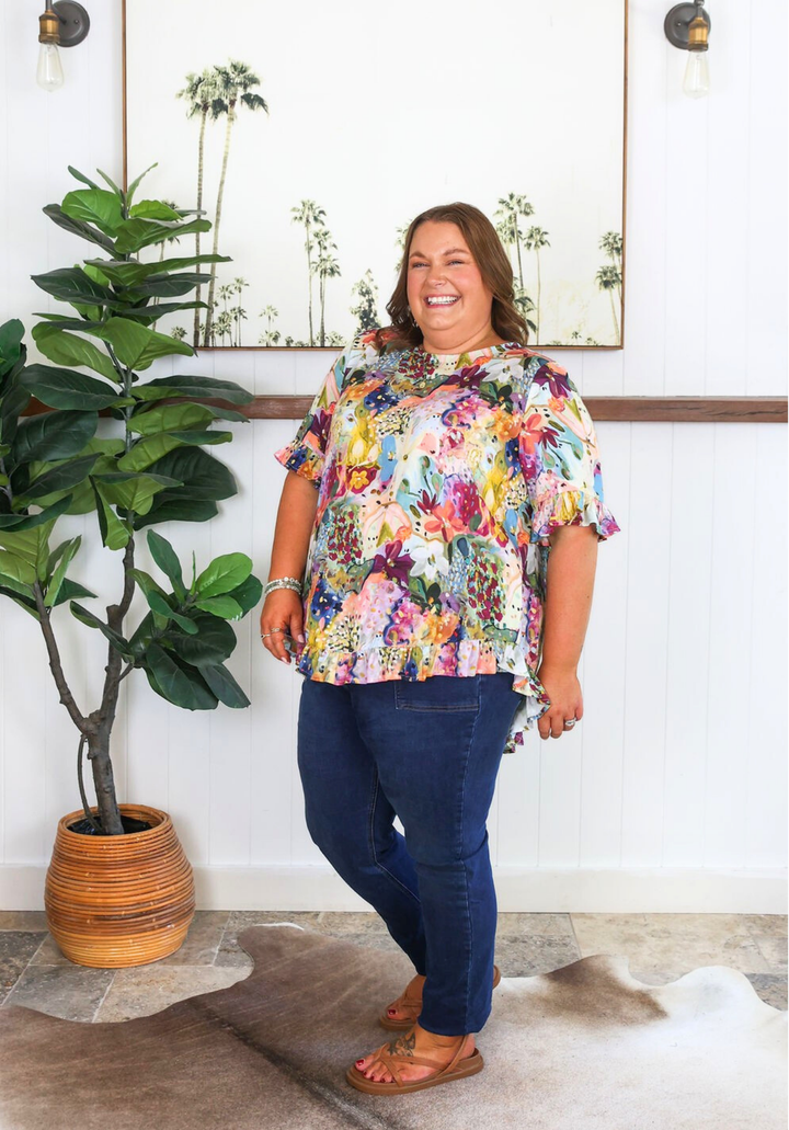 Daisy's Closet New Look Mila petal print top for women, short sleeve button-back design with floral pattern.