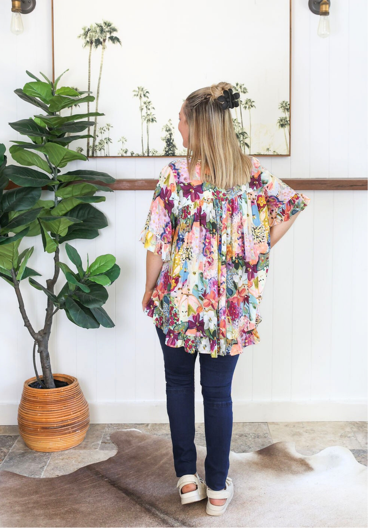 Daisy's Closet New Look Mila petal print short-sleeve button-back top with floral design, perfect for casual or summer wear.