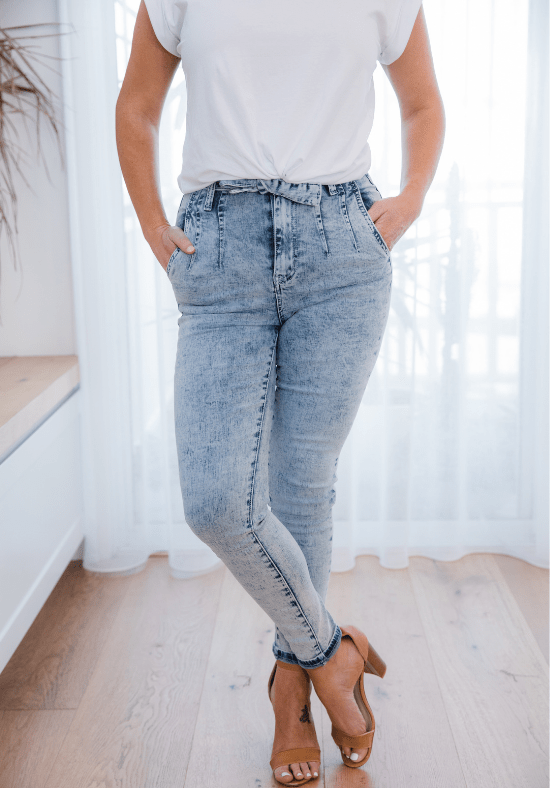Ladies High Waisted Jeans - Light Blue Acid Wash - Optional Tie Belt at Waist - Functional Front and Back Pockets - Zip Front - Full Length - Sizes 6 - 18 - Daisy Denim Jeans Size 10 Close Up View Paired with Daisy T-Shirt White - Daisy's Closet