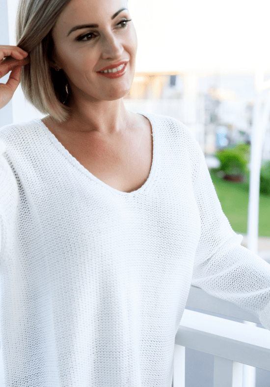 Ladies Cotton Knit Jumper - V Neckline - Rolled Hemline - Sizes Sm - L/XL - Millie Knit Close Up Front View Showing Details Daisy's ClosetLadies Long Sleeve Knit - Jumper - 100% Cotton - V Neckline - Super Soft + Lightweight - Sizes S/M - L/XL - Millie Knit White Close Up Front View Showing Detailing - Daisy's Closet