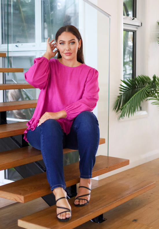 Ladies Long Sleeve Button Back Top - Magenta - Curved Neckline - Curved Hemline front and back - Size L/XL Front Sitting View paired with Carter Curve Dark Denim Jeans - Daisy's Closet Mila Magenta Top