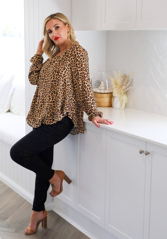 Ladies Long Sleeve Leopard Top - Button Back Top - Long Sleeve with elasticised cuff - curved hemline front and back - right front side standing view of size S/M - Daisy's Closet