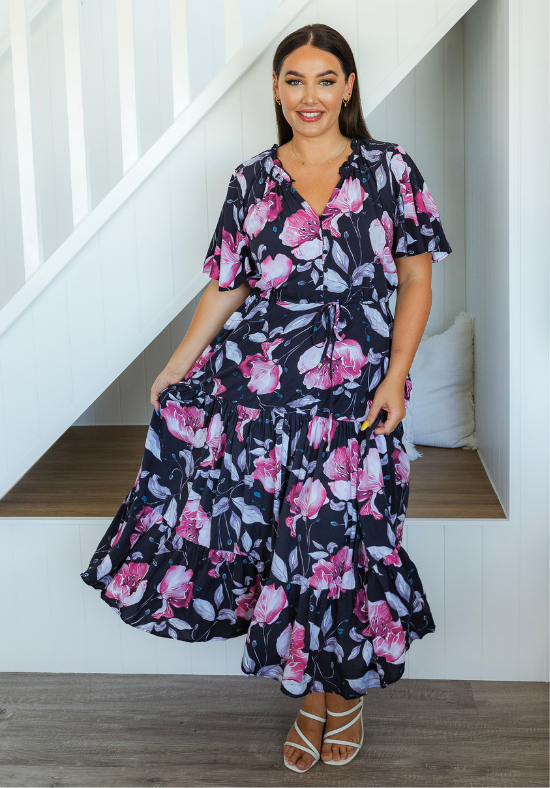 Ladies Maxi Dress - Adjustable waisttie - Elasticised Neckline - Pink and White Floral Pattern on a Navy Background - Demi Maxi Dress - Daisy's Closet Front On Standing  View Size 14