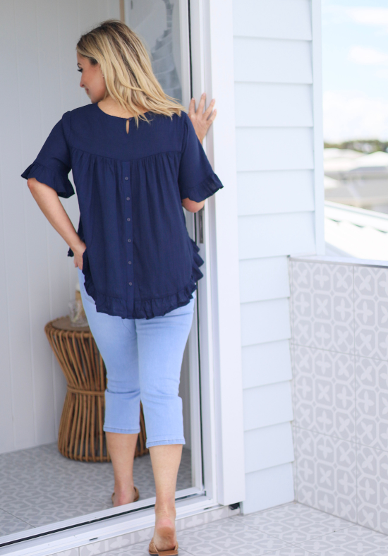 Ladies Short Sleeve Top - Button Back Top - Navy - Short ruffled sleeve - Curved hemline front and back - Front full length S/M View - Daisy's Closet