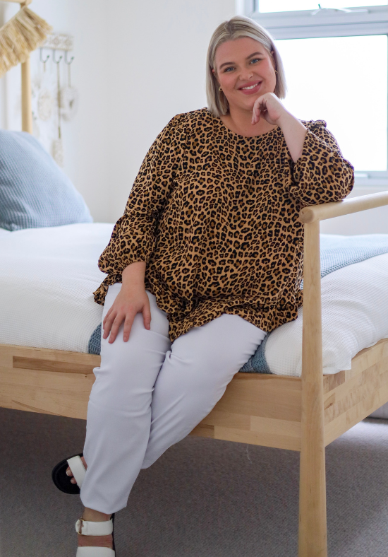 Ladies Long Sleeve Leopard Top - Button Back Top - Long Sleeve with elasticised cuff - curved hemline front and back - close up front sitting view size xl/xxl - Daisy's Closet