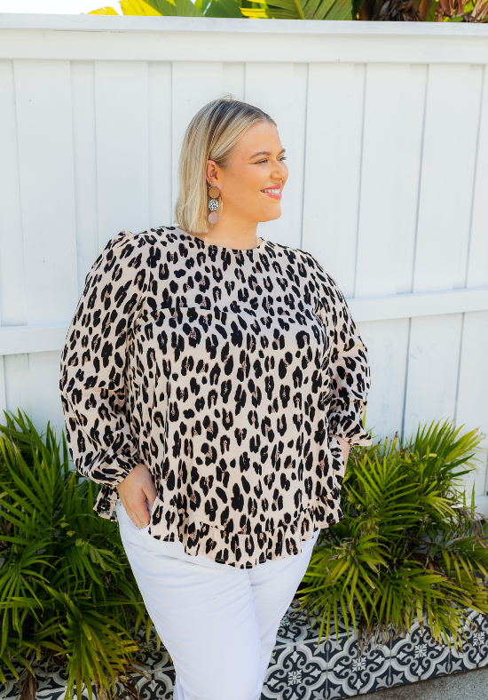 Light leopard print long sleeve top from Daisy's Closet with a comfortable fit, perfect for casual wear.