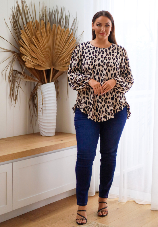 Light leopard print long sleeve top by Daisy's Closet, stylish shirt with soft fabric and relaxed fit.