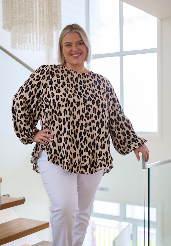 Light leopard print long sleeve top from Daisy's Closet featuring a comfortable fit and stylish design.